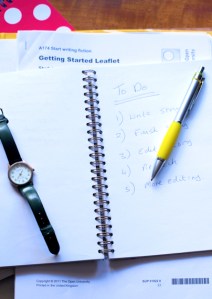 Open University work and notebook.